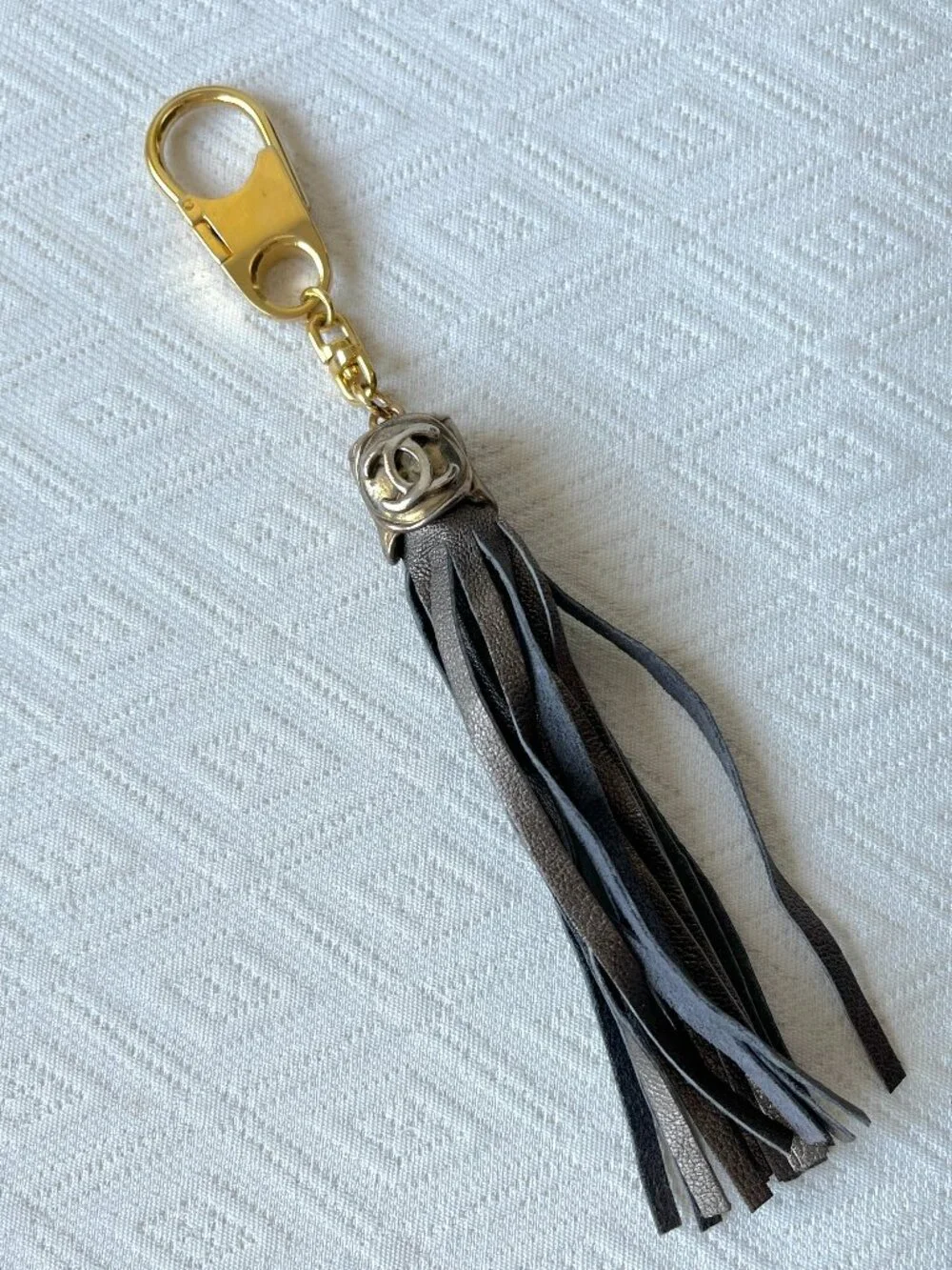 CC keychain gold with bronze leather fringe vintage